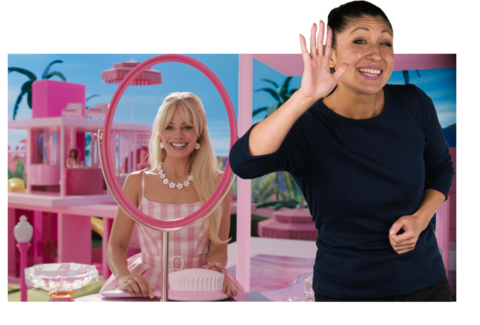 ASL performer Leila Hanaumi signs “Hello!” in front of a scene from Barbie.