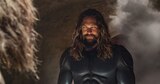 Aquaman stares intently while wearing his stealth suit.