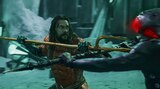 Aquaman wields his golden trident in a battle against Black Manta, who is armed with the Black Trident.