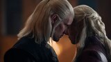 Close-up of Prince Daemon Targaryen leaning in close to Queen Rhaenyra Targaryen, his forehead touching her left temple.