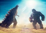 Godzilla and Kong roar at each other as they stand in front of the Great Sphinx of Giza.