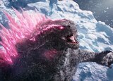 Godzilla’s eyes and spikes glow pink as he stands on an iceberg and roars.