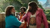 Steve and Garrett look each other in the eyes as they grab each other’s forearms in a handshake. Dawn stands nearby and looks at Garrett quizzically.