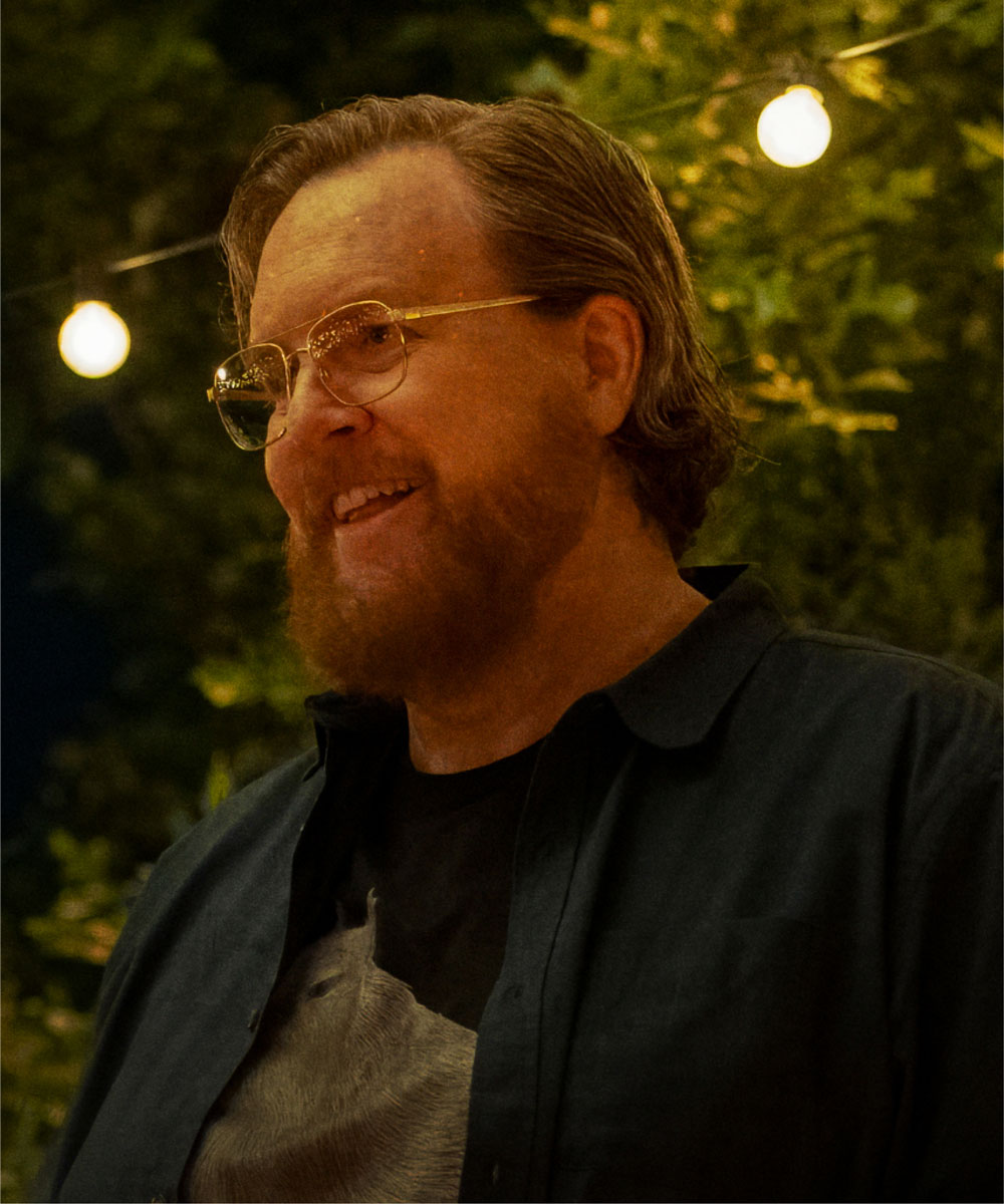 Steve Agee as John Economos
