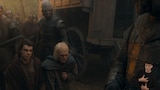 Larys Strong and King Aegon II kneel, surrounded by armored guards and soldiers in a foggy forest beside a wooden caravan. Aegon has a pained expression on his face as he leans forward slightly and rests his left fist on his chest. Larys looks up at an armored soldier in the foreground. In the bottom right side of the image, ASL dubber Landen Gonzales signs “Chest hurting.”