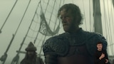Tyland Lannister stands on the deck of a ship. He wears ornate armor and has a bloody scrape on his left cheek. He looks suspiciously at something out of frame. In the background, there are tall masts, rigging, sails, and two crew members. On the bottom right side of the image, ASL dubber Landen Gonzales signs "I didn't."